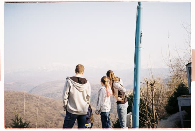 Family enjoying a mountain view together