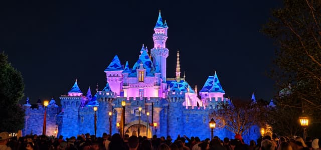 Family enjoying Pixar Pier at Disneyland at night